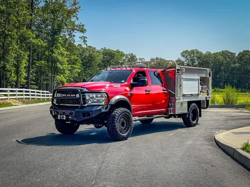Left-side profile view with crew cab and side compartments.